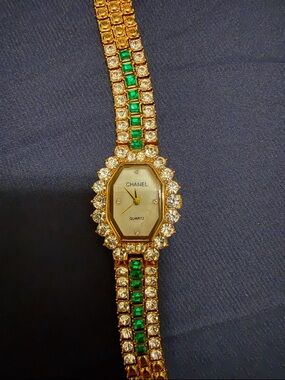 Gold Tone braclet watch with green & crystal stone